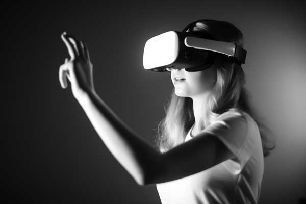 teenage girl wearing a VR headset